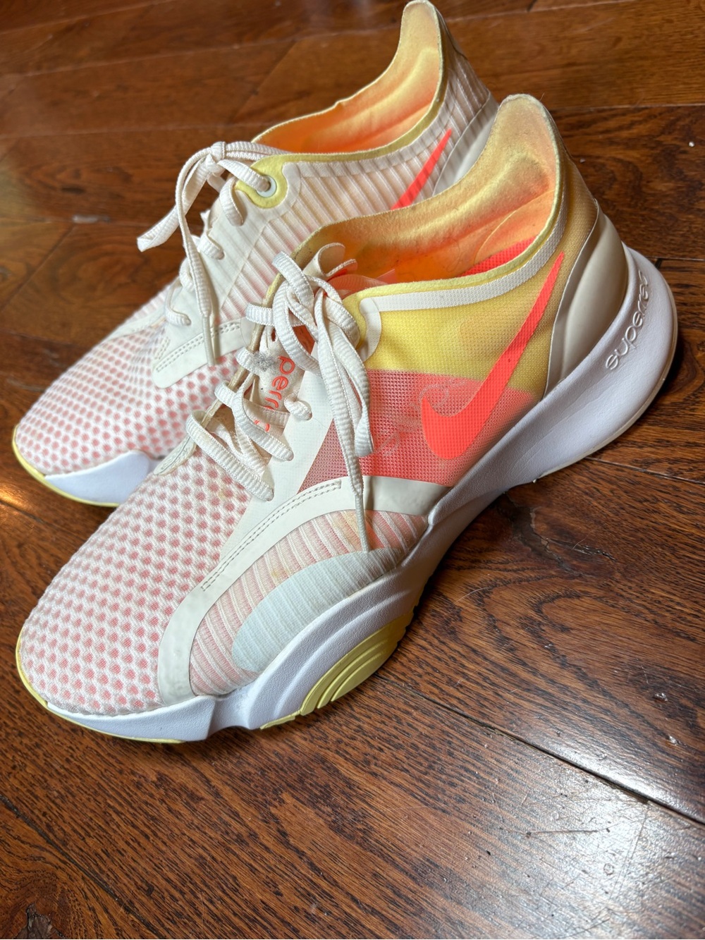 Nike Women's Cream, Pale Pink & Yellow Running Sneakers with Coral Swoosh